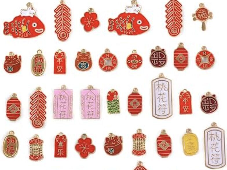 Red and gold Chinese New Year charms including lanterns, lucky fish, and firecrackers