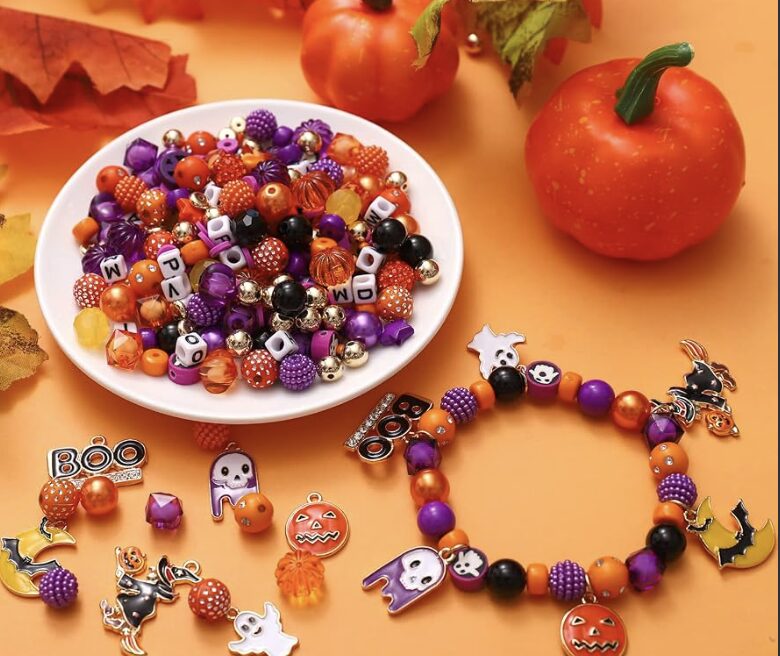 Halloween beads and charms including pumpkins, ghosts, and bats